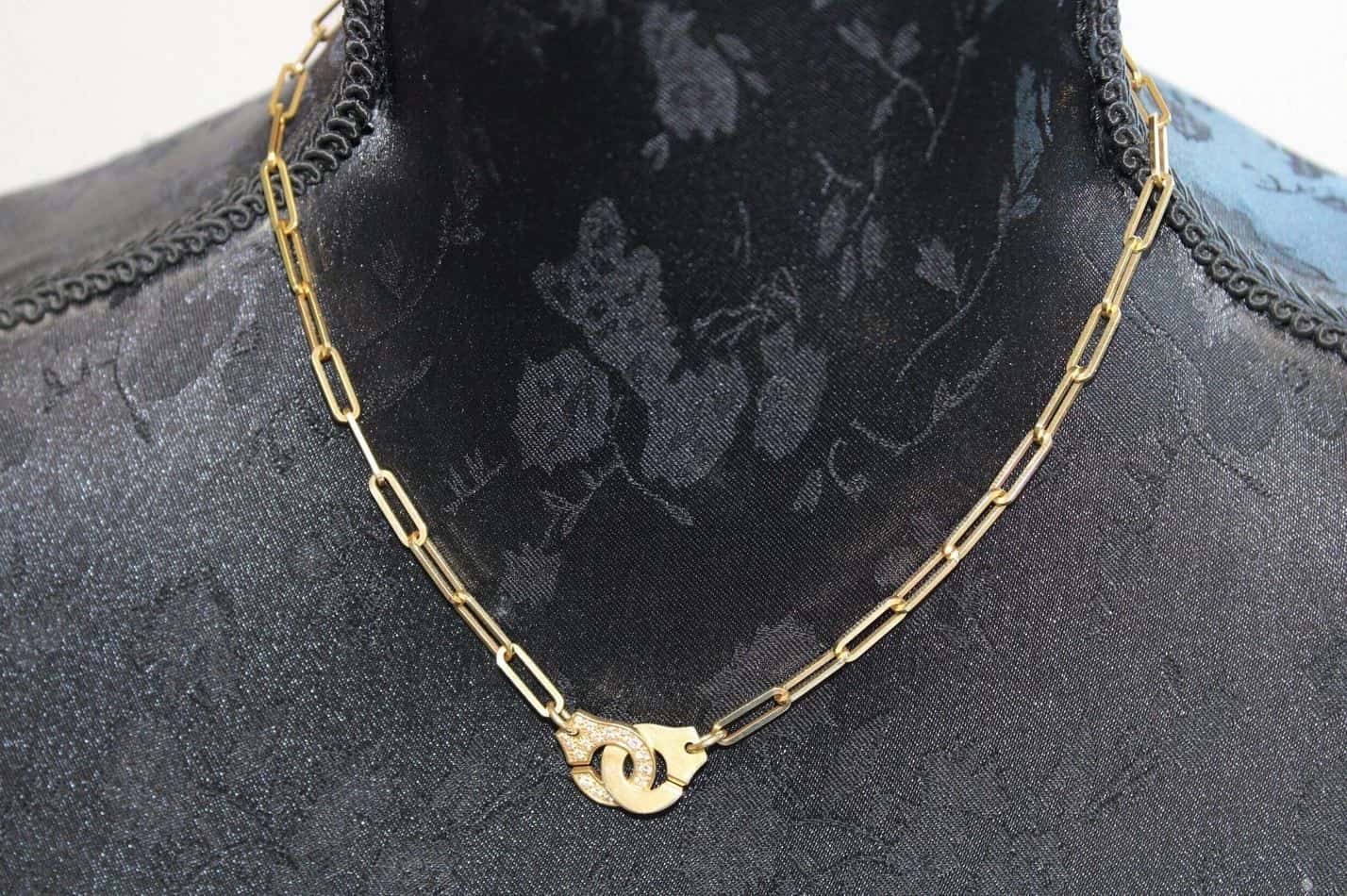 Collier Dinh Van "Menottes" en or et diamants