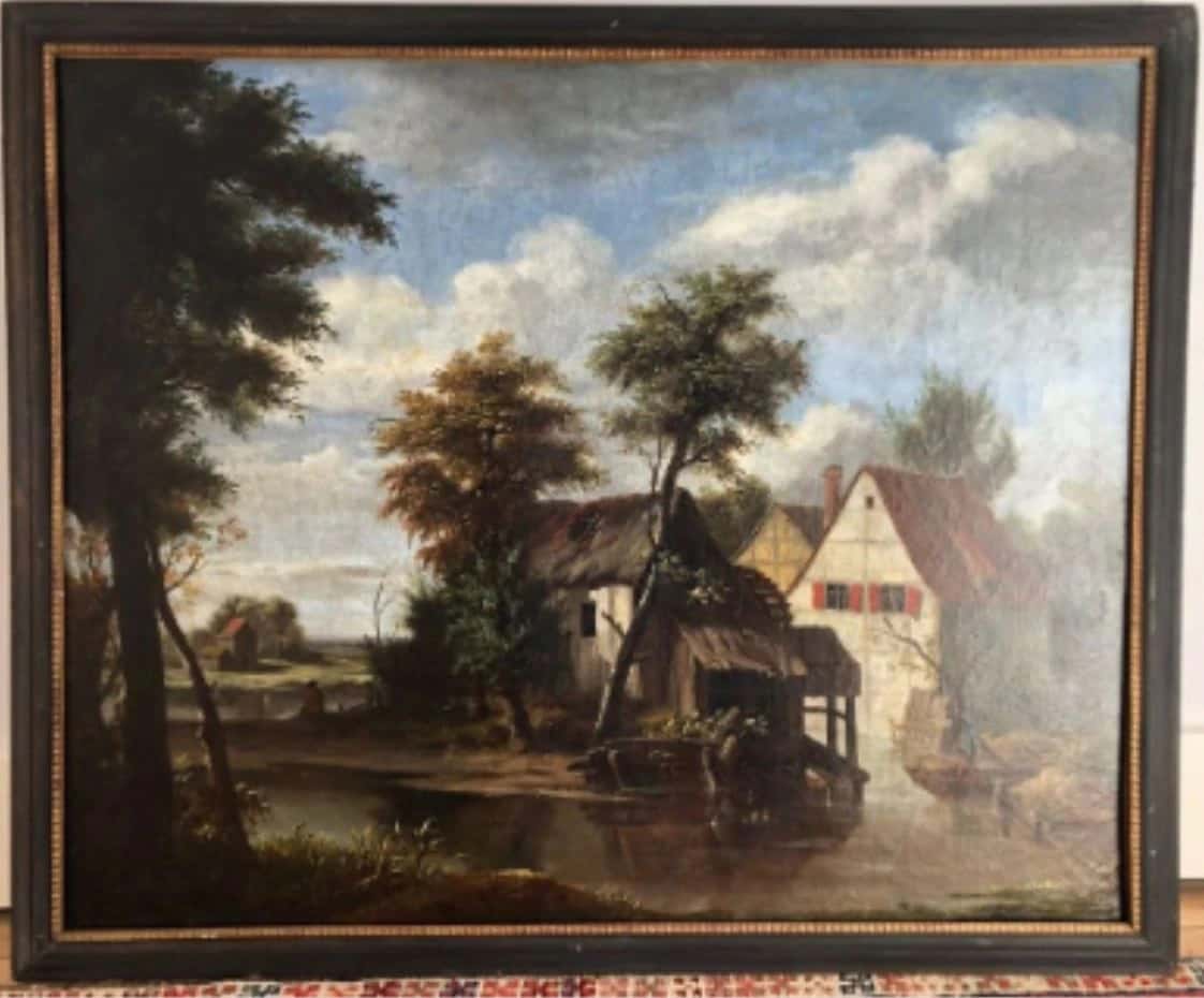 Vue d'un moulin au bord d'un canal